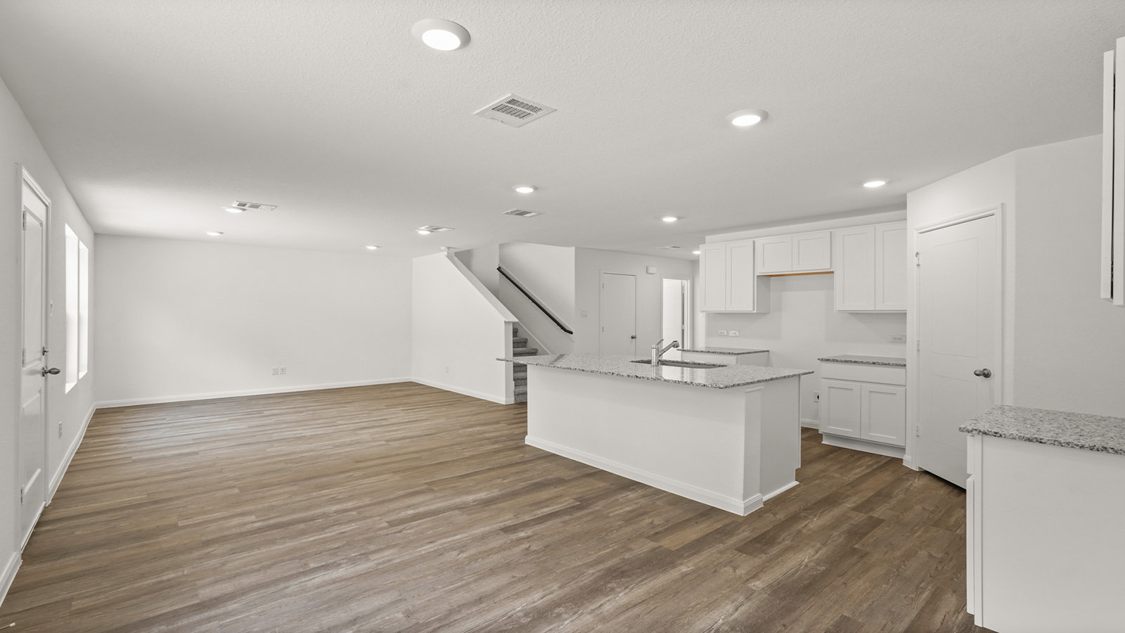 Open concept living, dining, and kitchen area