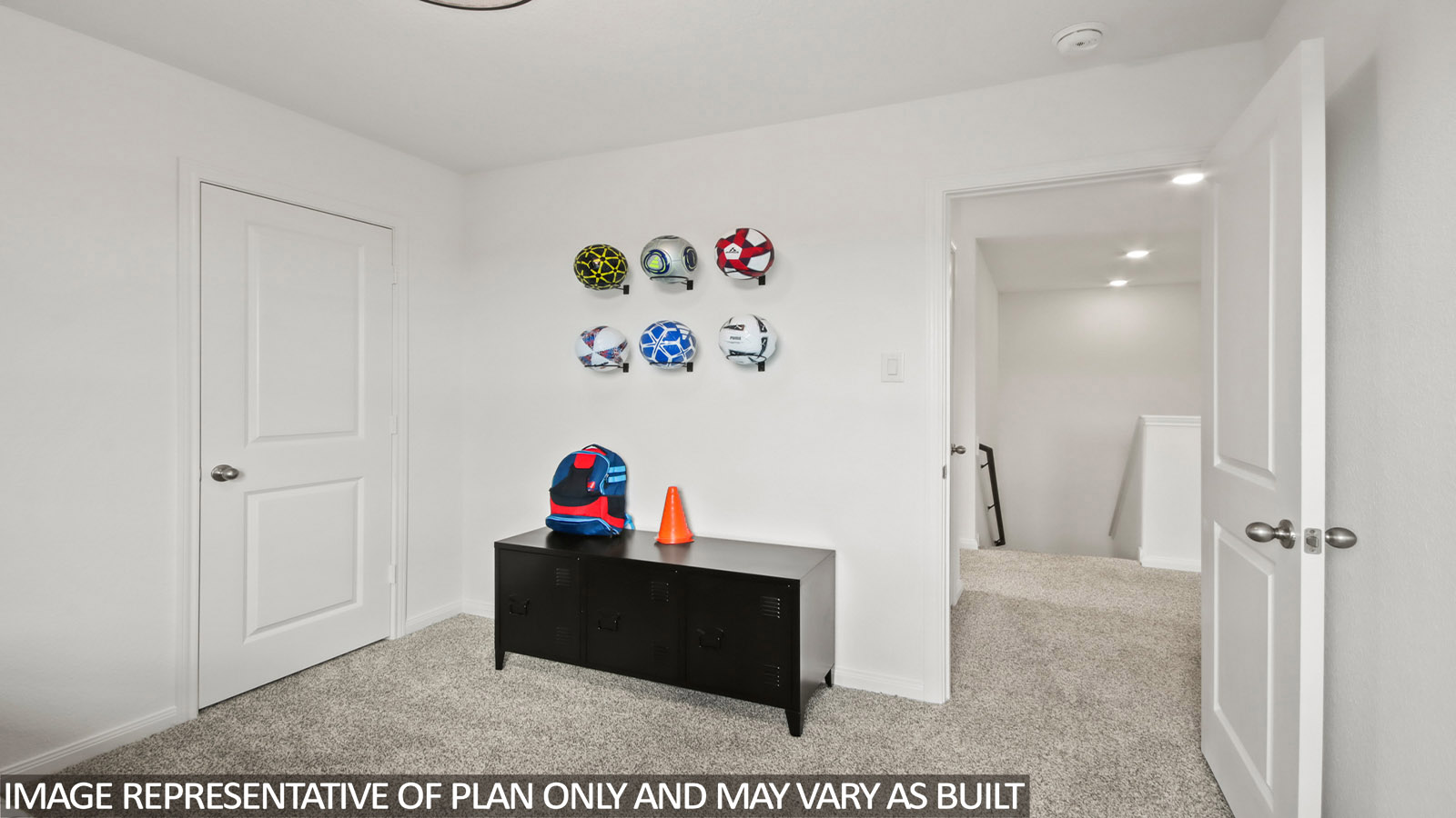 Secondary bedroom with carpet flooring