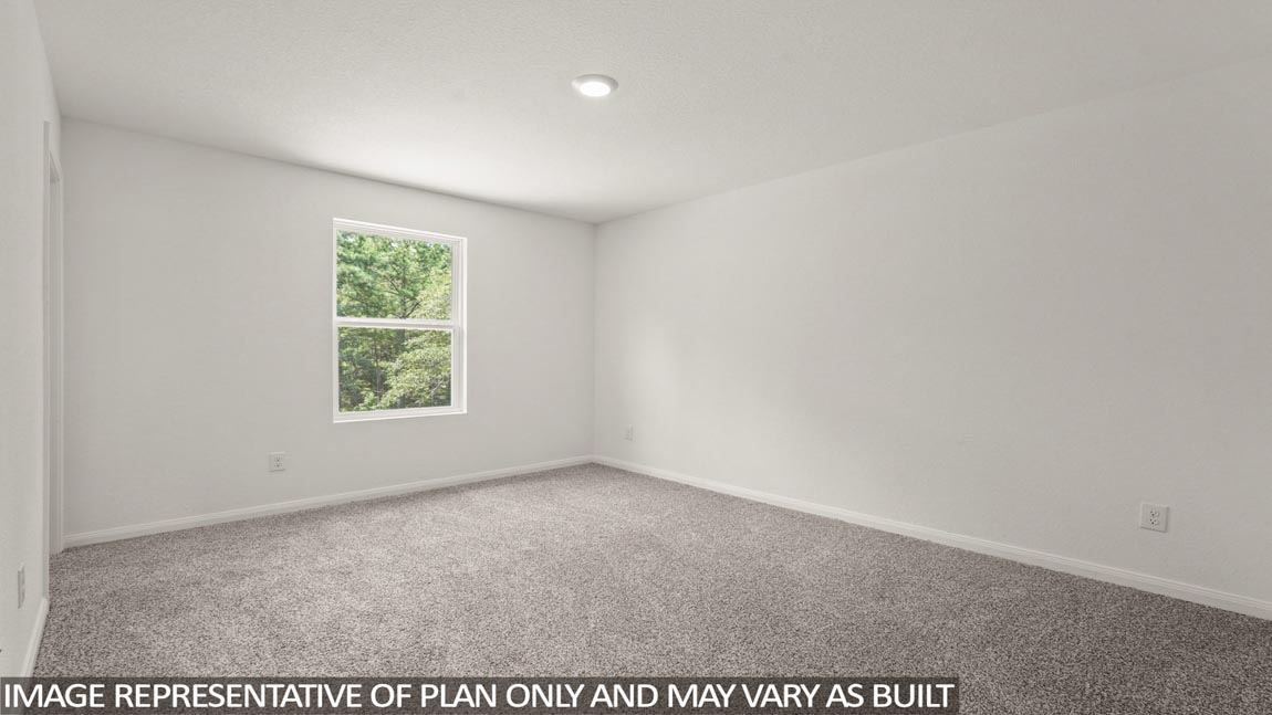 Primary bedroom with bright windows