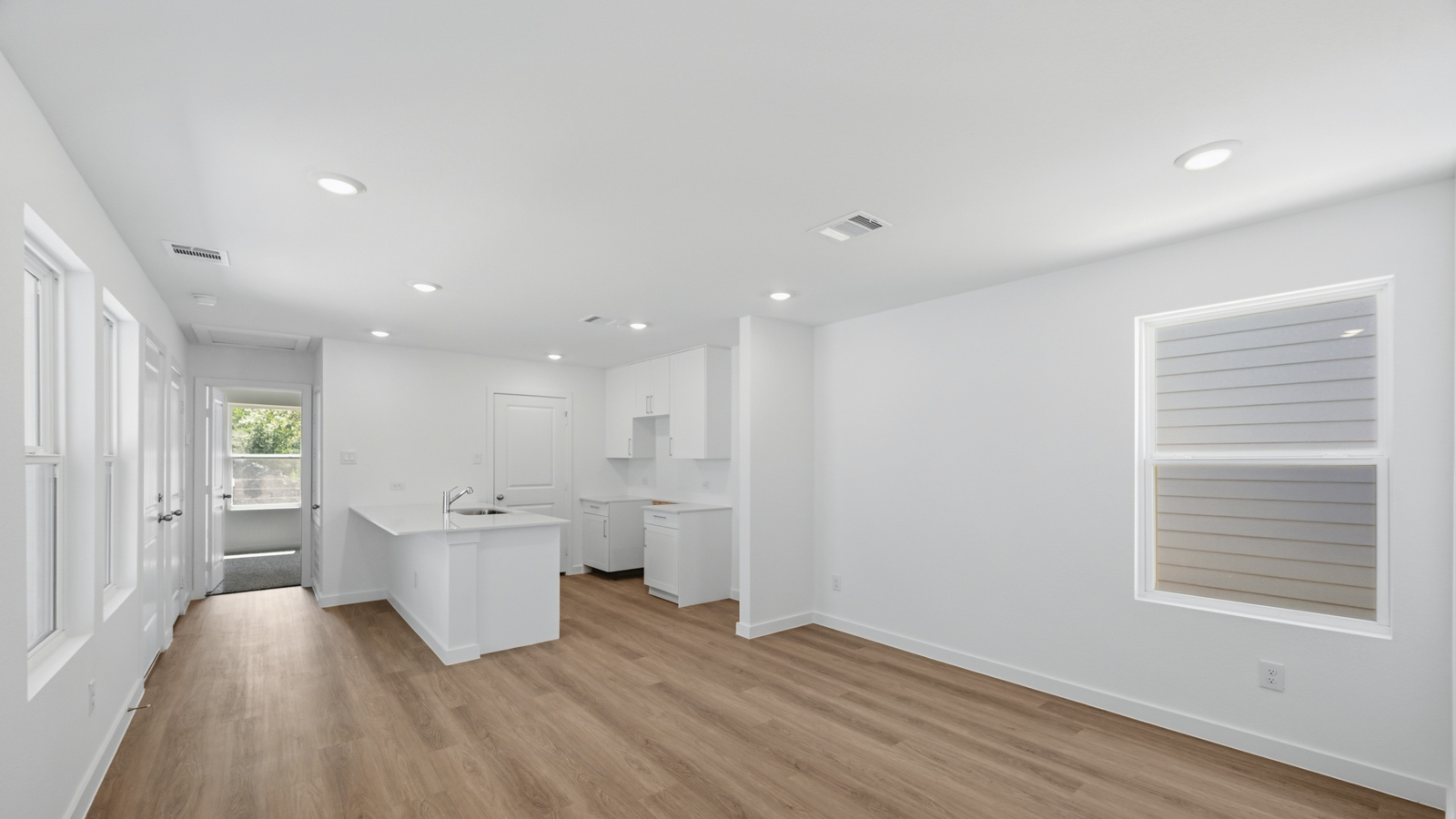 Open concept living, dining, and kitchen area