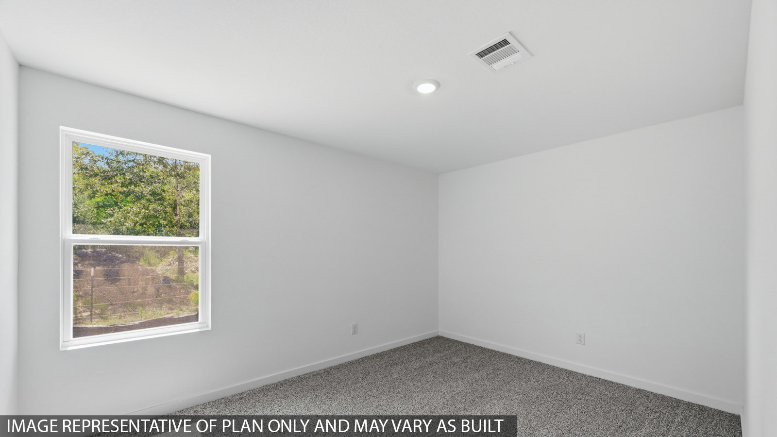 Primary bedroom with carpet flooring