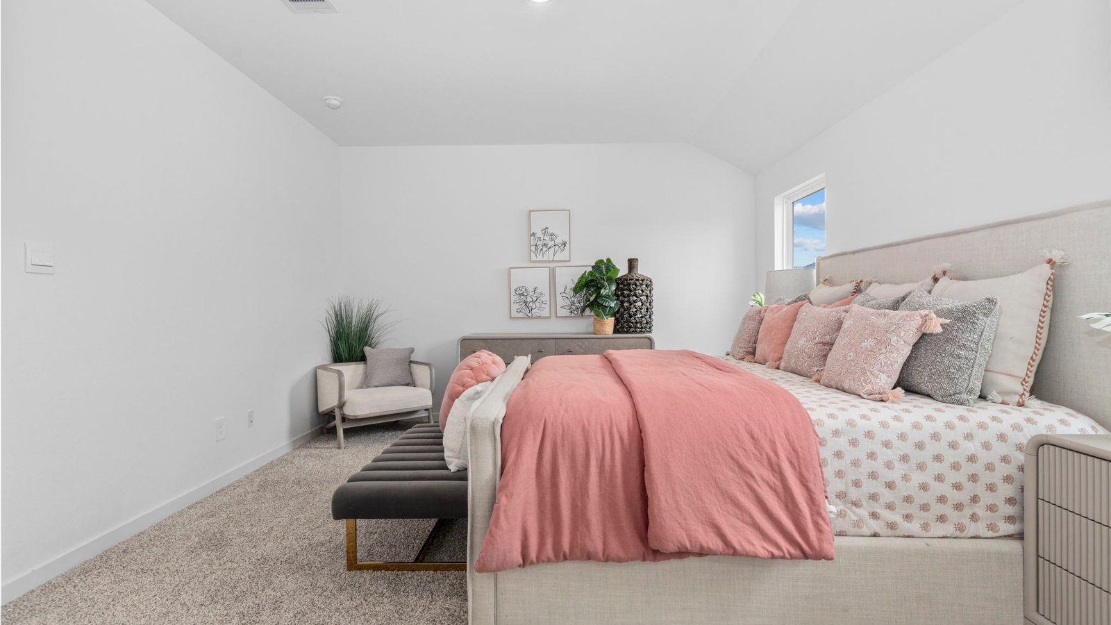 A spacious primary bedroom emphasizing open space and natural lighting