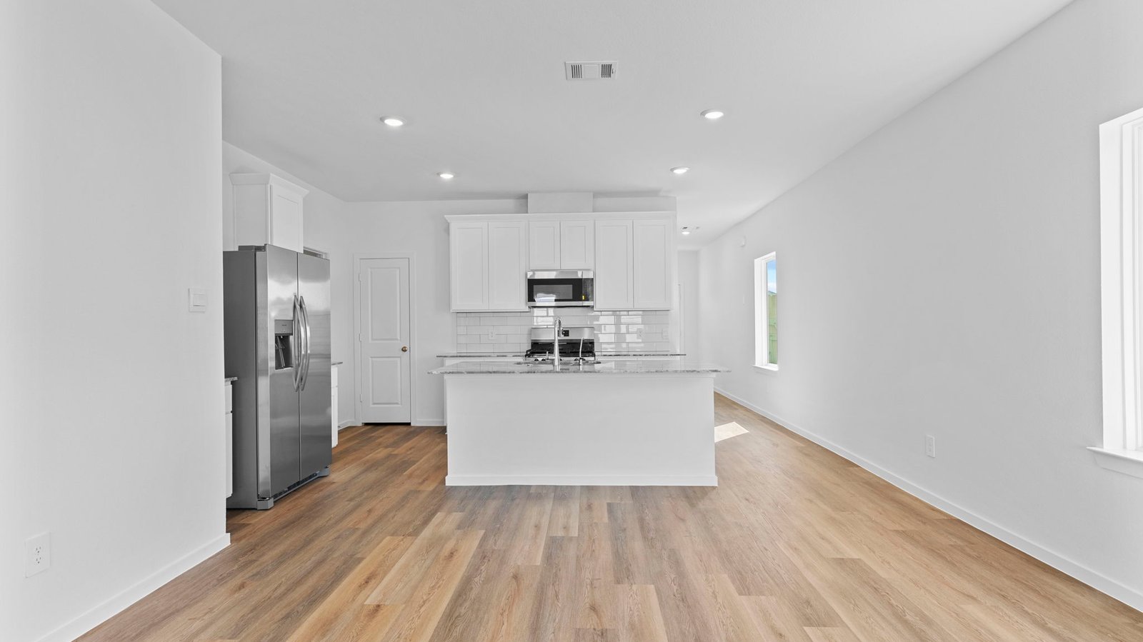 living and dining area next to kitchen
