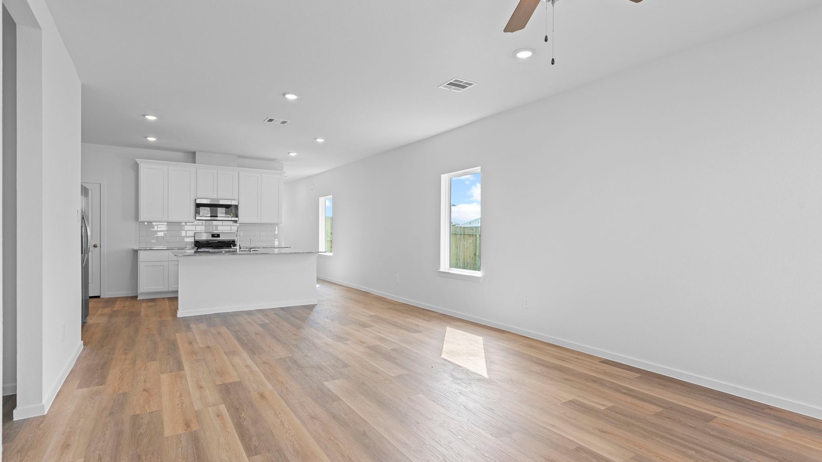 living and dining area next to kitchen