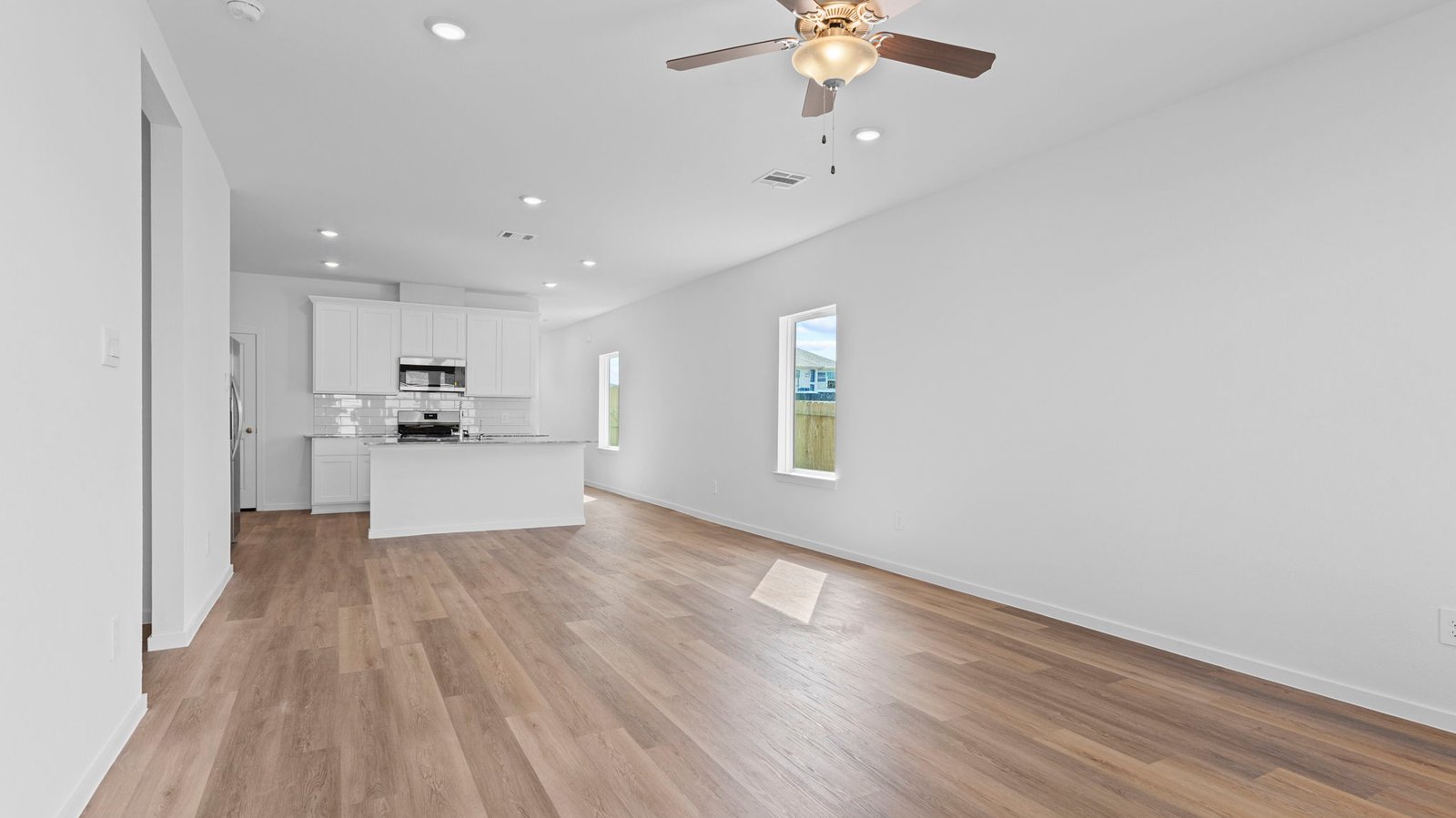 living and dining area next to kitchen