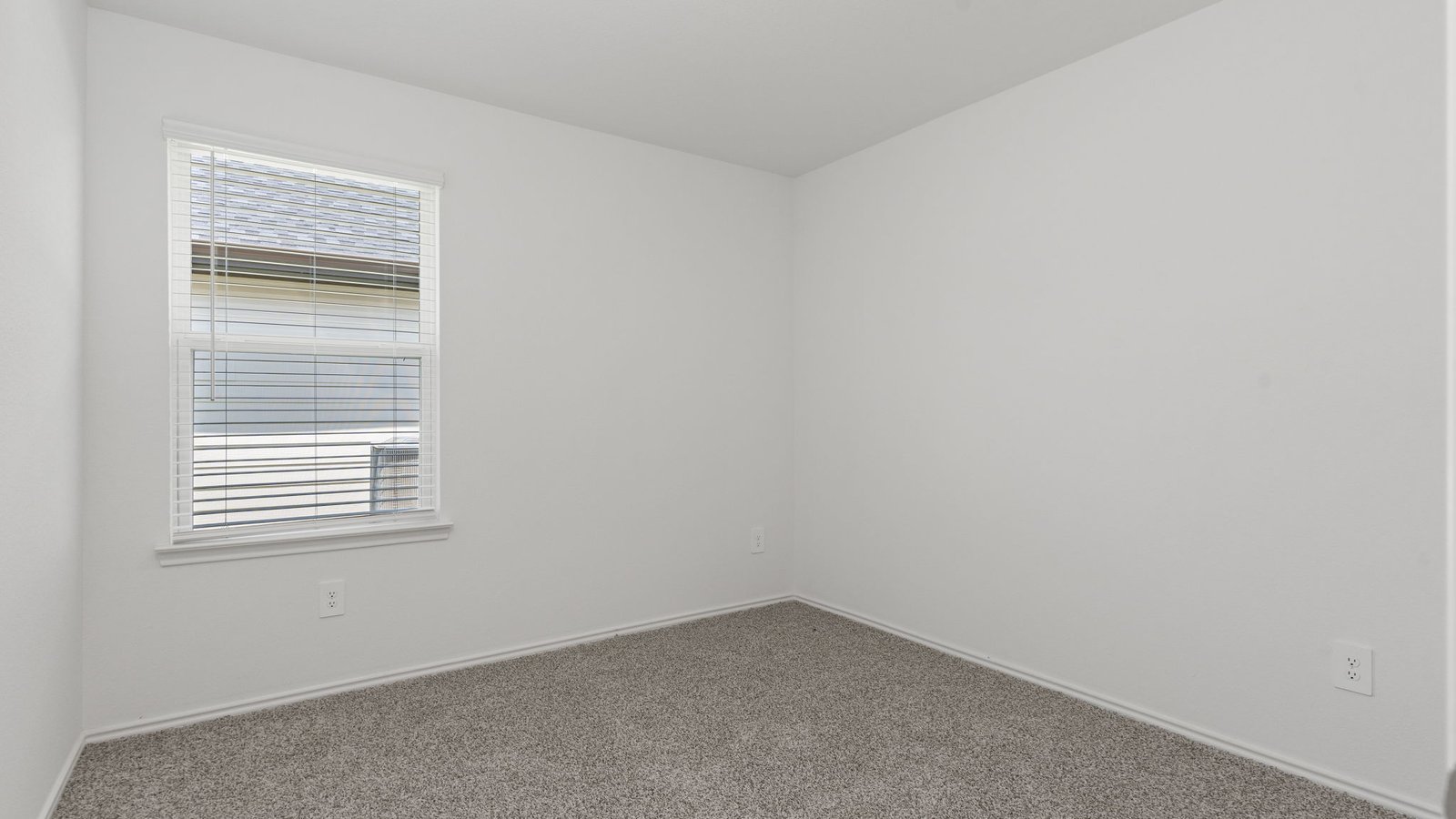 dalton front bedroom with carpet and window