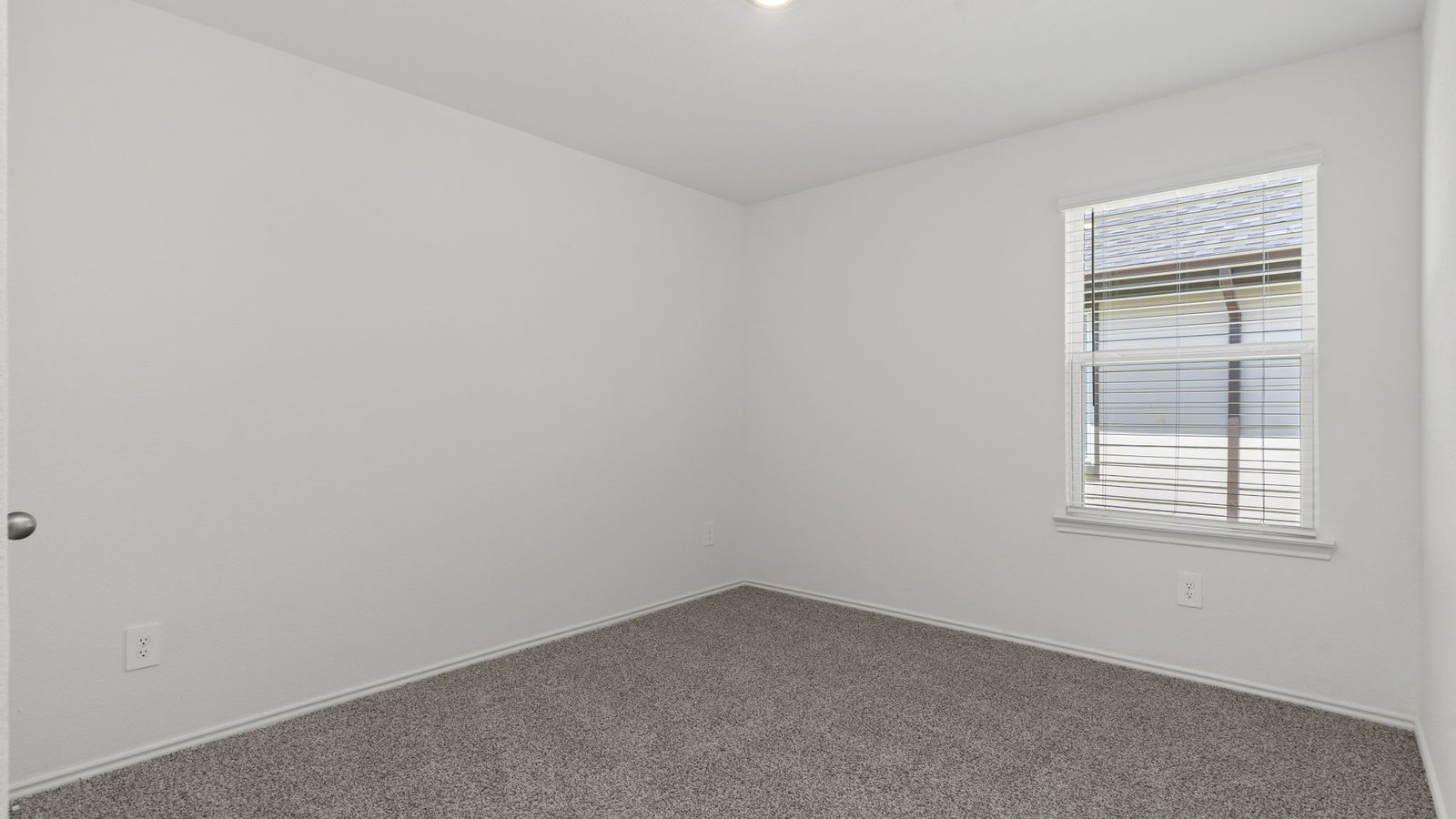 dalton front bedroom with carpet and window