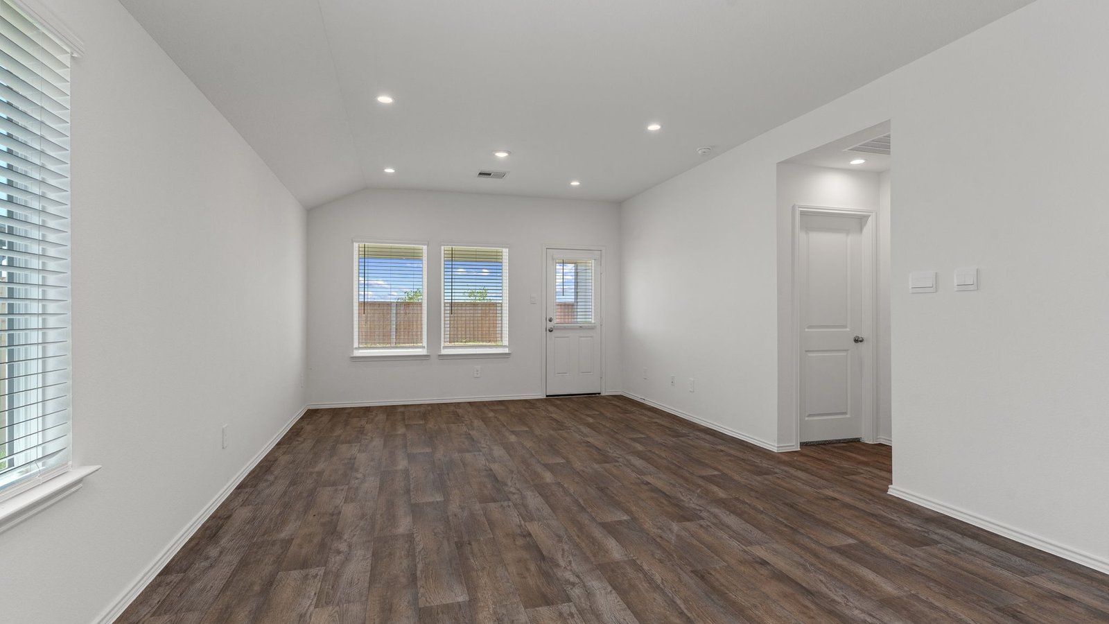 Living and dining room next to kitchen