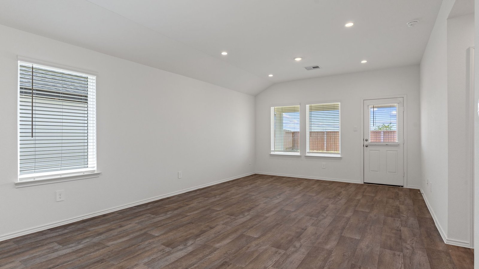 Living and dining room next to kitchen