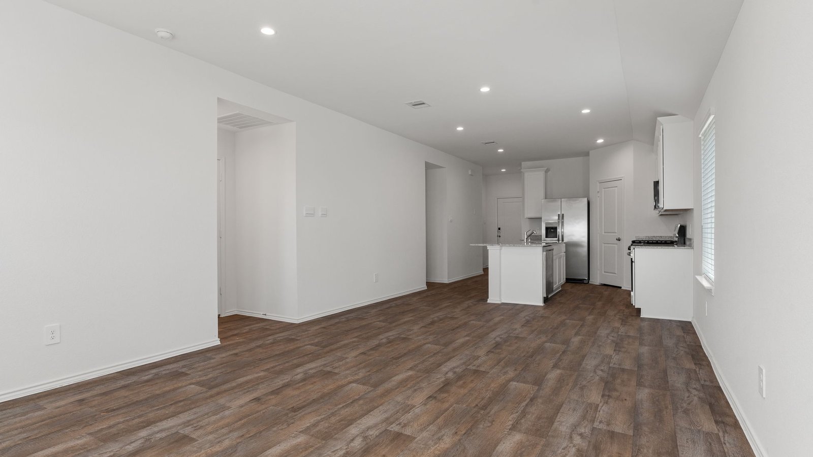living room overlooking dining room and kitchen