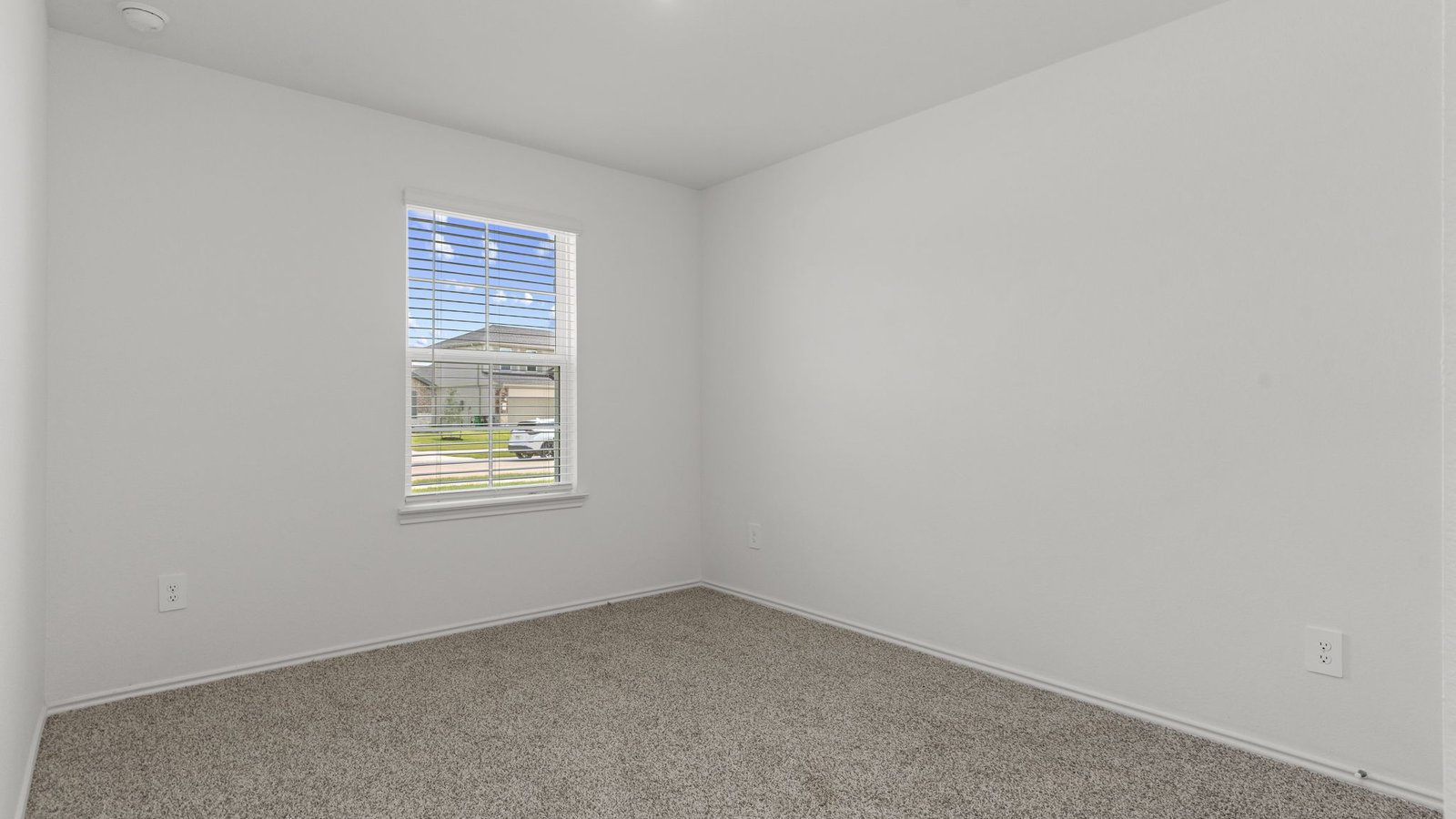 dalton front bedroom with carpet and window