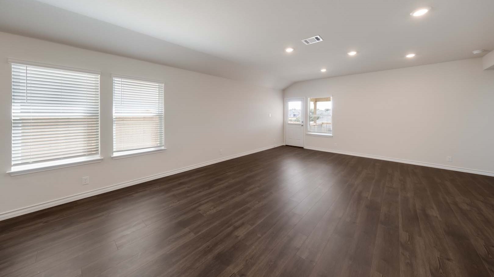 Open living and family room area with ample natural light