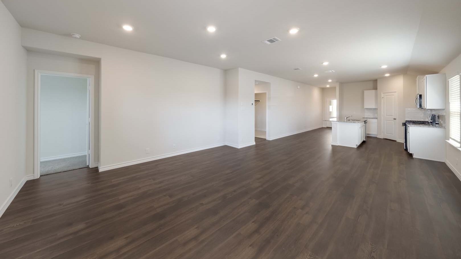 Open concept kitchen, living, family, and dining room space