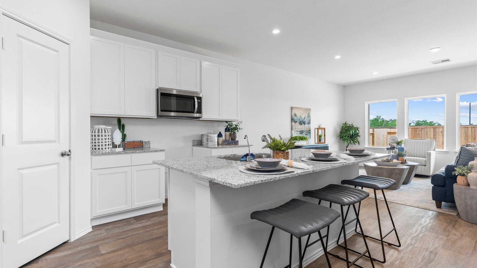 Spacious open concept kitchen with island and counter prep space