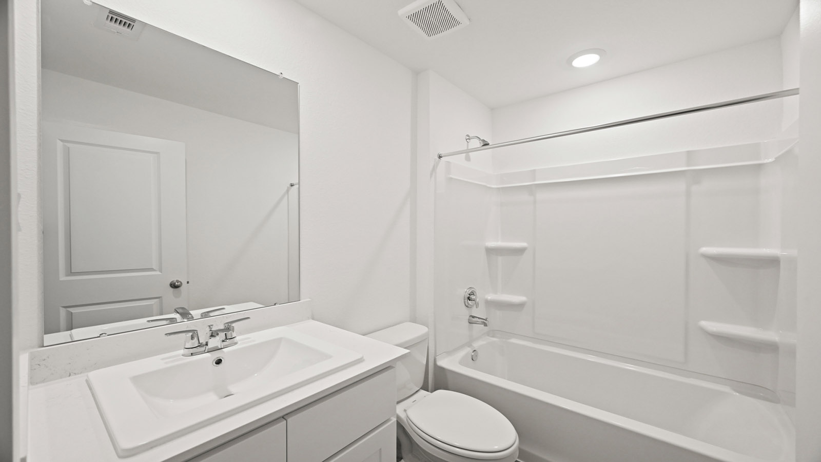 Guest bathroom with built in vanity and combination bathtub shower