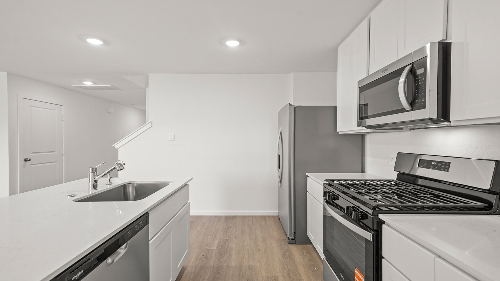 Spacious open concept kitchen with island and counter prep space