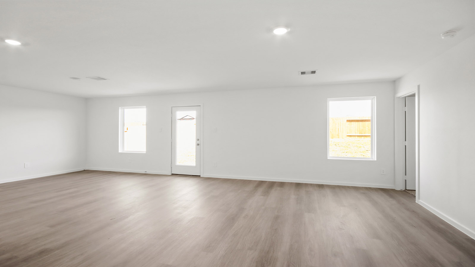 Open living and family room area with ample natural light