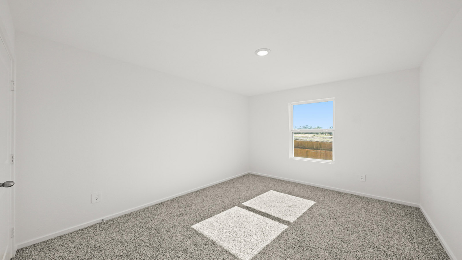 Guest bedroom 4 with plush carpet and side window