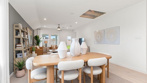 dining area with open concept living area with natural lighting