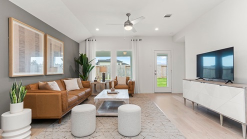 open concept living area with natural lighting and back patio