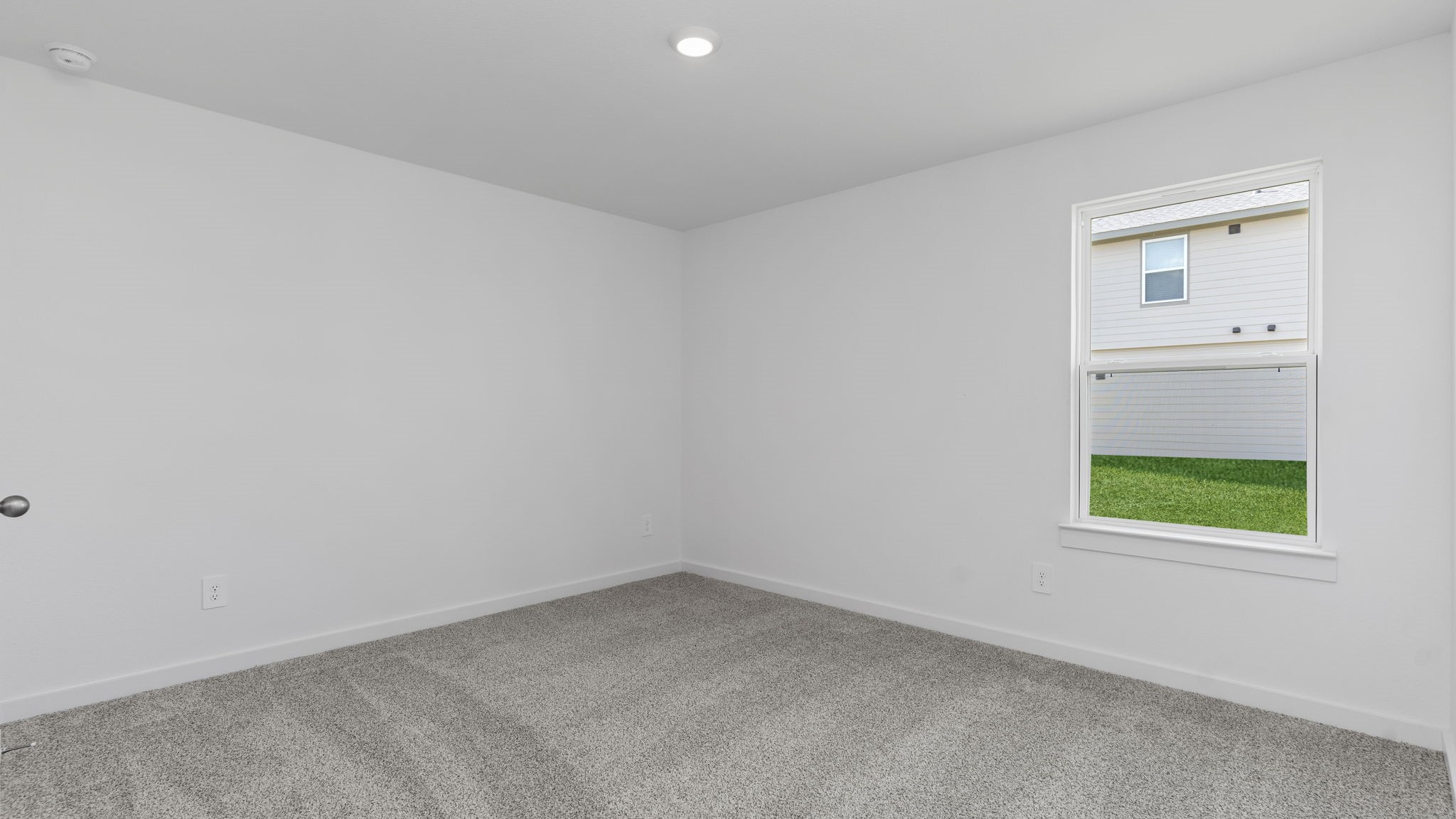 Guest bedroom 1 with front windows and ample natural light