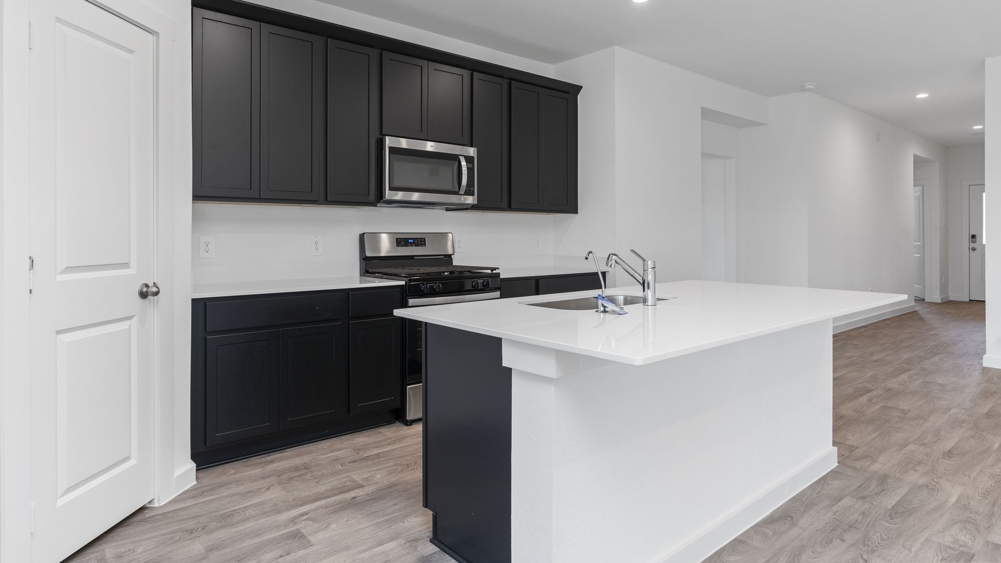 Spacious open concept kitchen with island and counter prep space