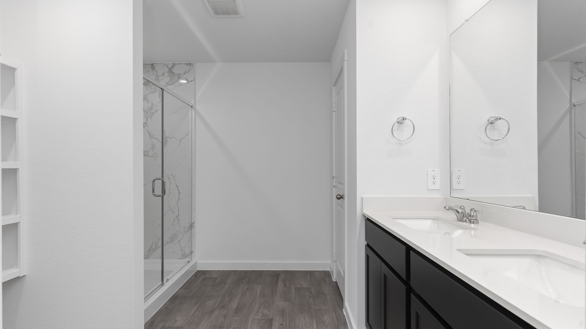 Primary bathroom with tiled shower and separate bathtub