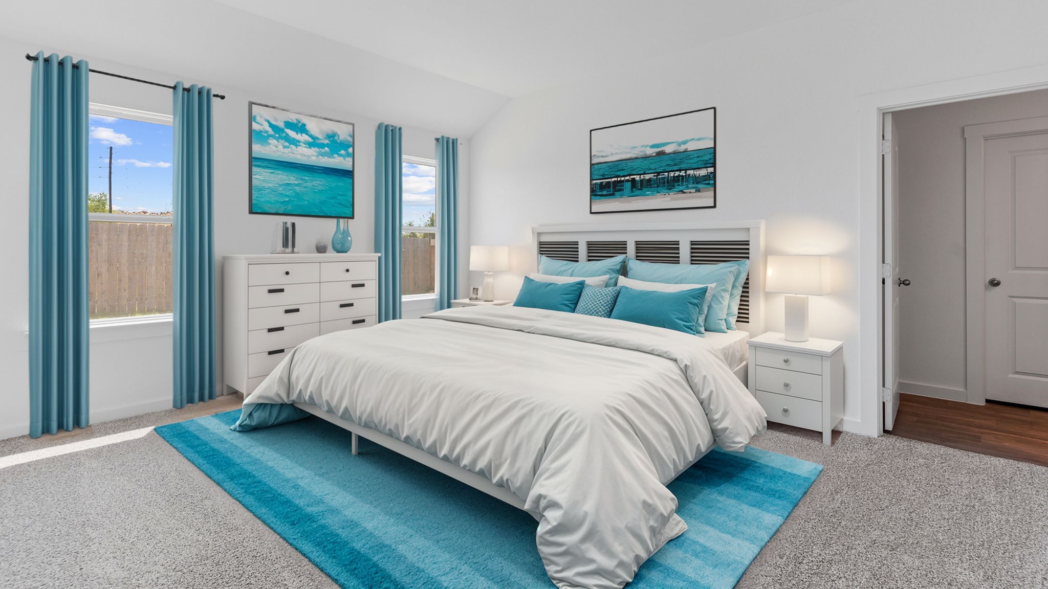 Primary bedroom with plush carpet floors and light allowing double windows
