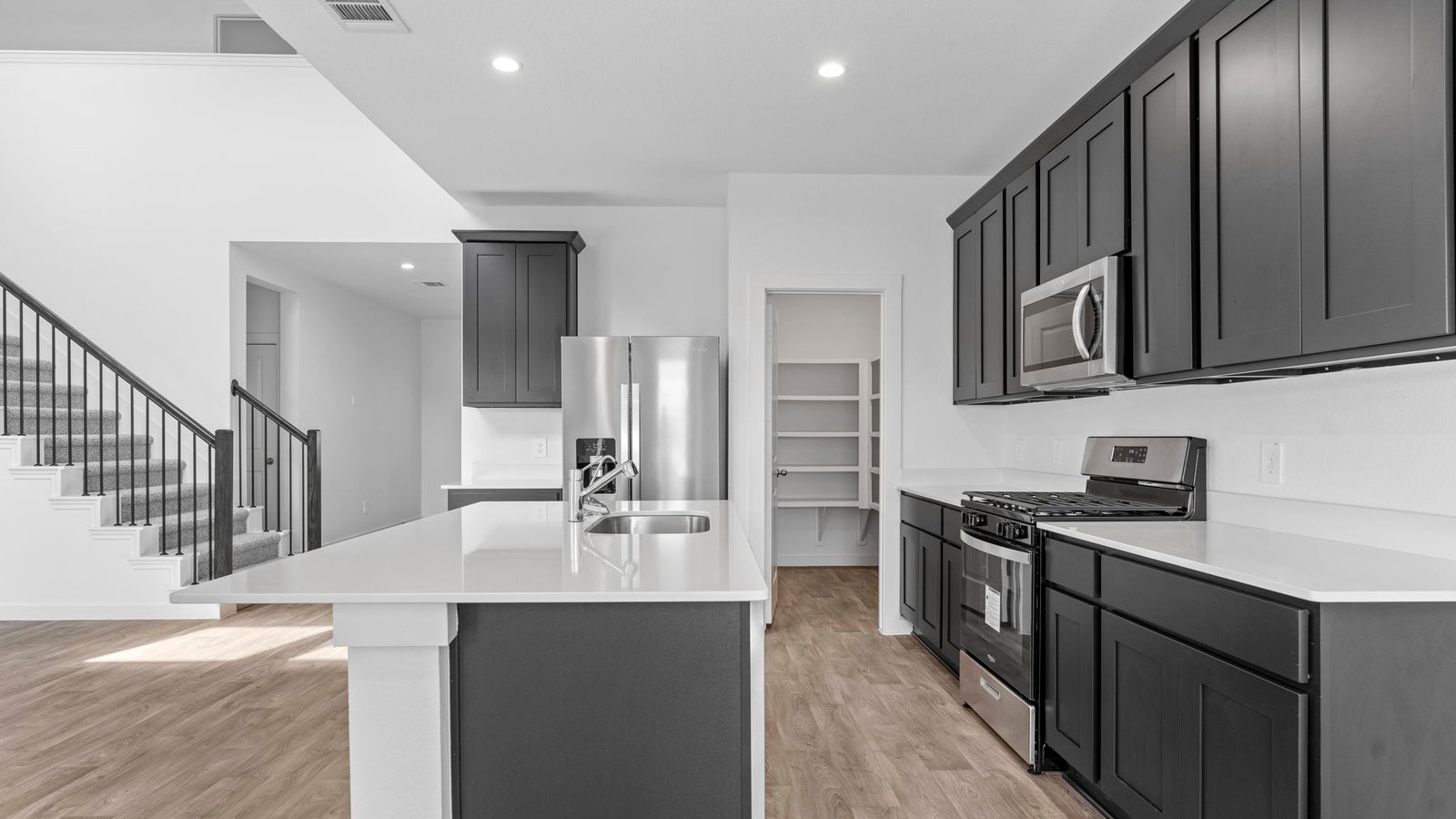 Spacious open concept kitchen with island and counter prep space