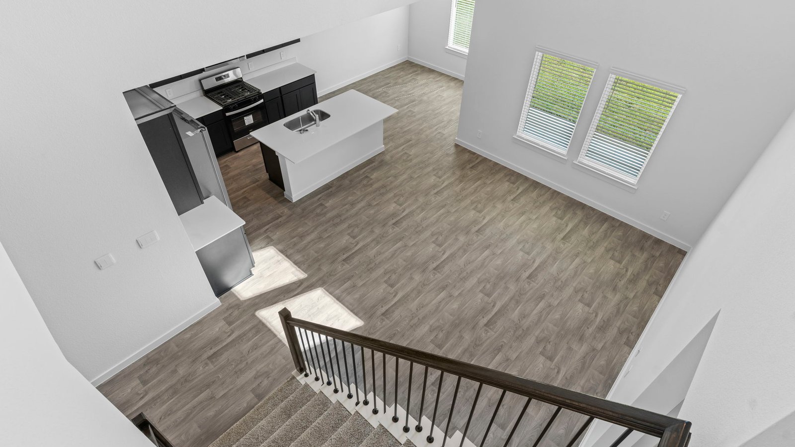 Upstairs landing space with balcony overlooking to downstairs foyer