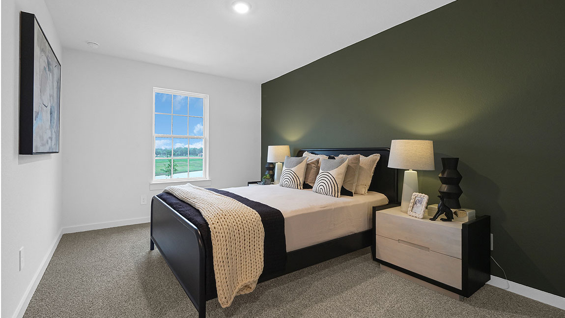 Guest bedroom 1 with front windows and ample natural light