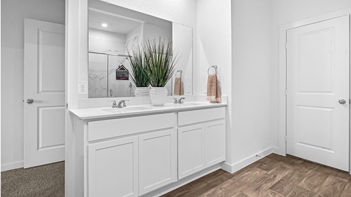 primary bathroom with quartz vanity tops