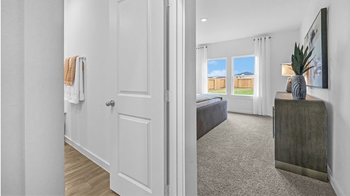 primary bedroom with primary bathroom