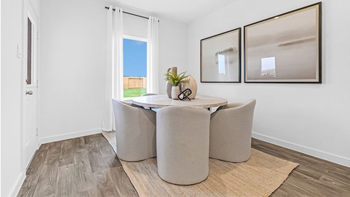 dining room area with table and chairs with natural lighting