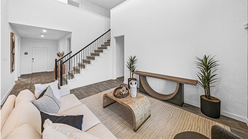 living area with high ceilings and stairs
