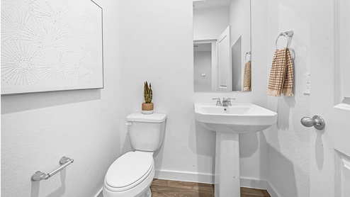 guest half bath with toilet and sink