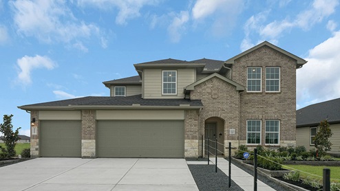 two story house with brick exterior and three car garage