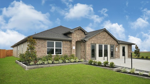 Single-story home with brick exterior and three car garage