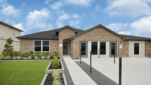 Single-story home with brick exterior and three car garage