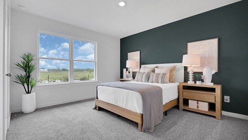 third bedroom with open space and windows