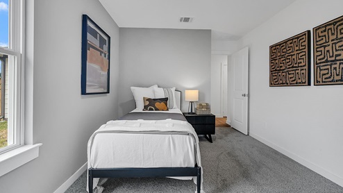 bedroom with window and closet