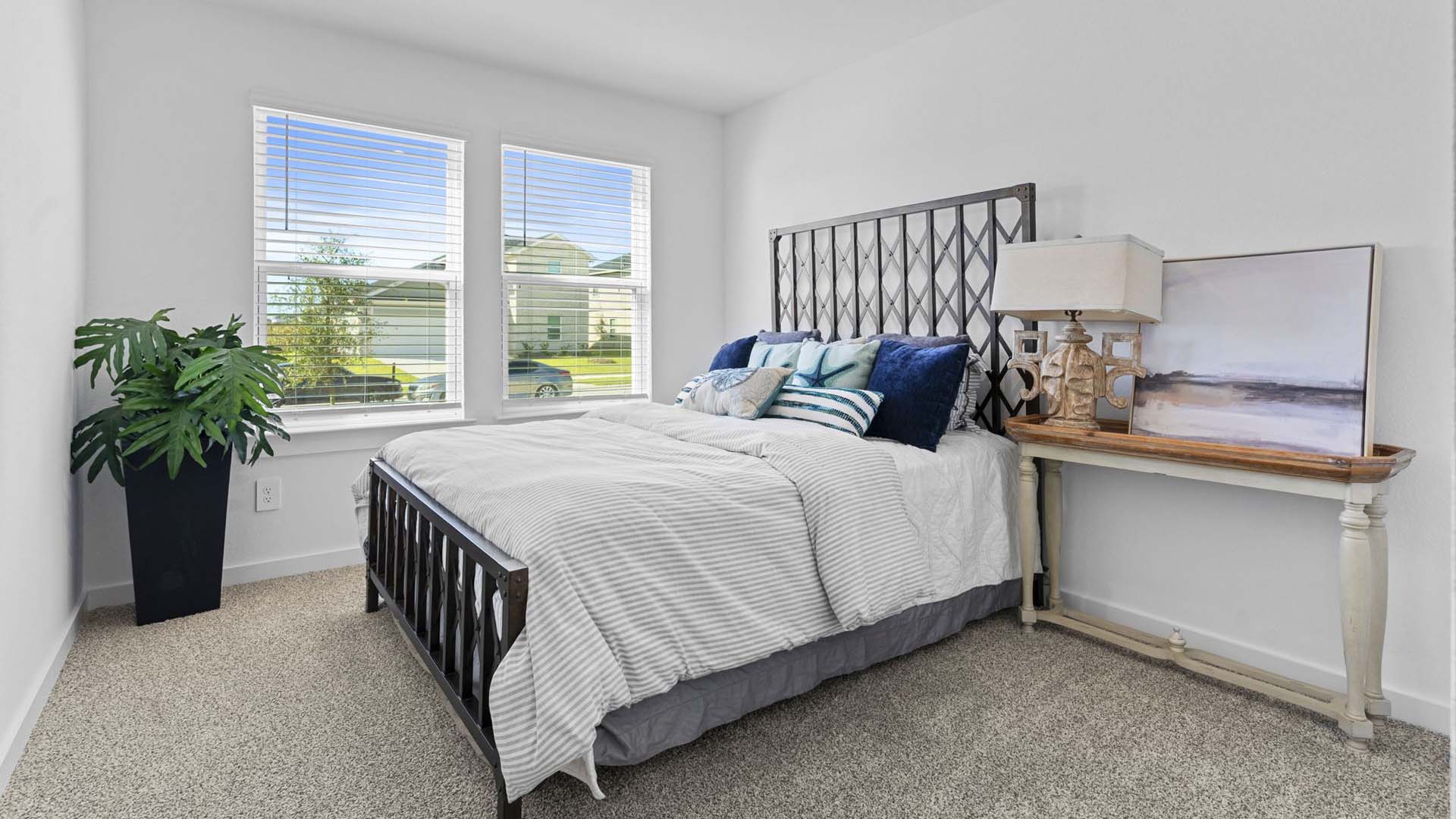 Guest bedroom 1 with front windows and ample natural light