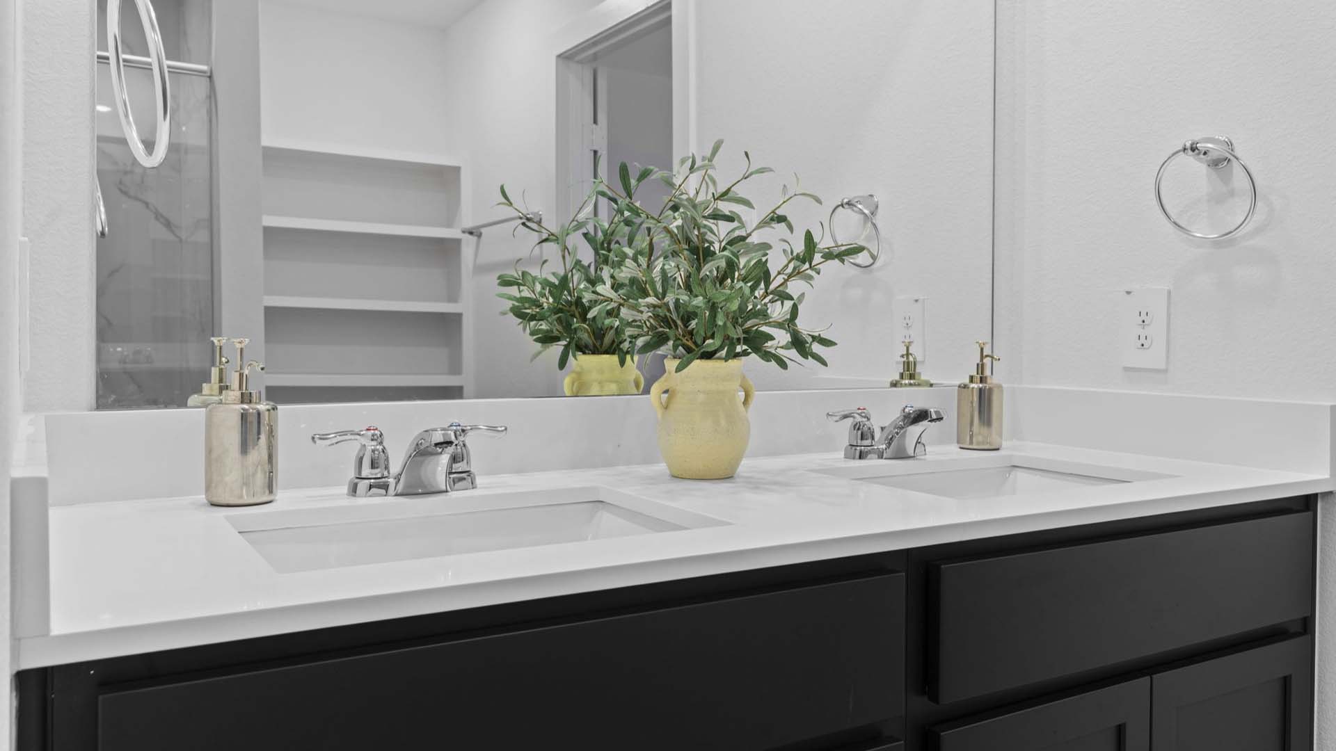 Private attached primary bathroom with built in vanity