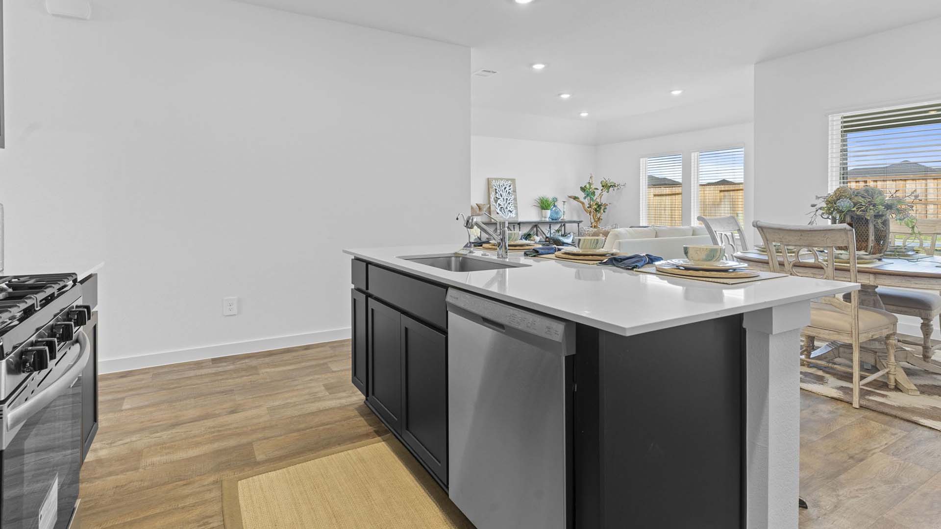 Spacious open concept kitchen with island and counter prep space