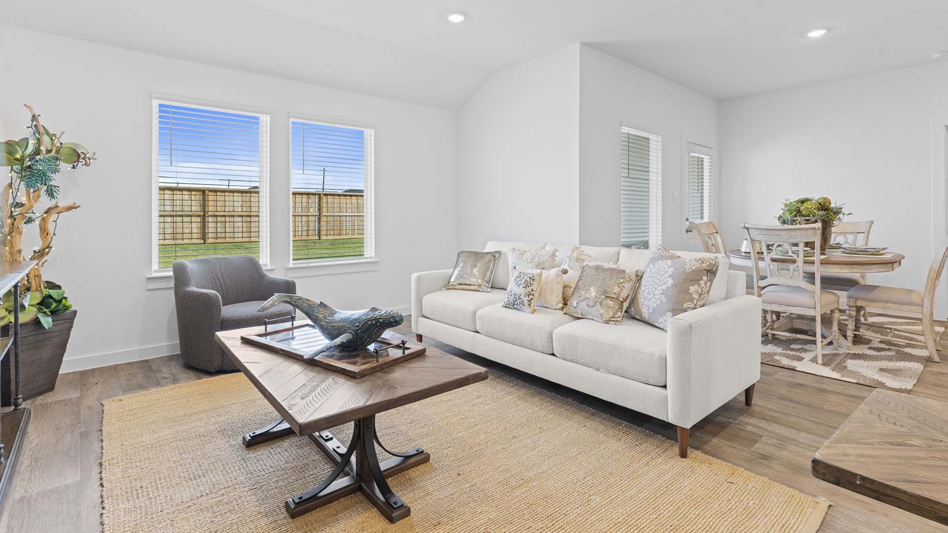 Open living and family room area with ample natural light