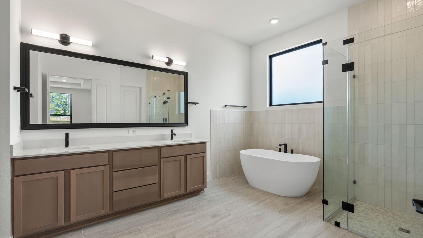 Luxurious primary bath with separate freestanding bathtub and shower