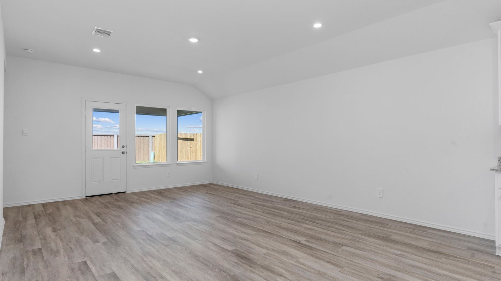 Open concept kitchen, living, family, and dining room space