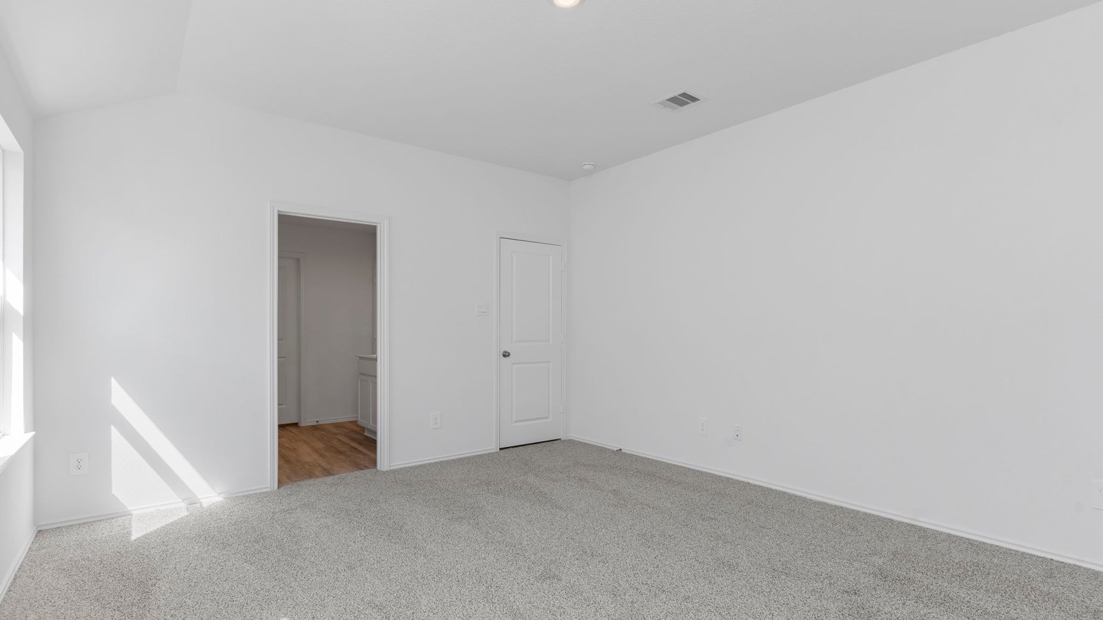 Guest bedroom 1 with front windows and ample natural light