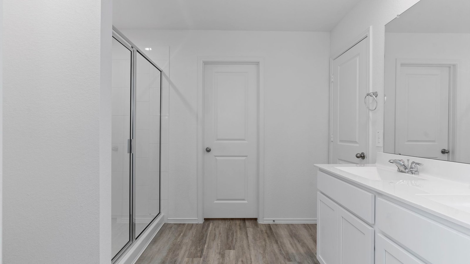 Primary bathroom with luxurious shower and built in storage