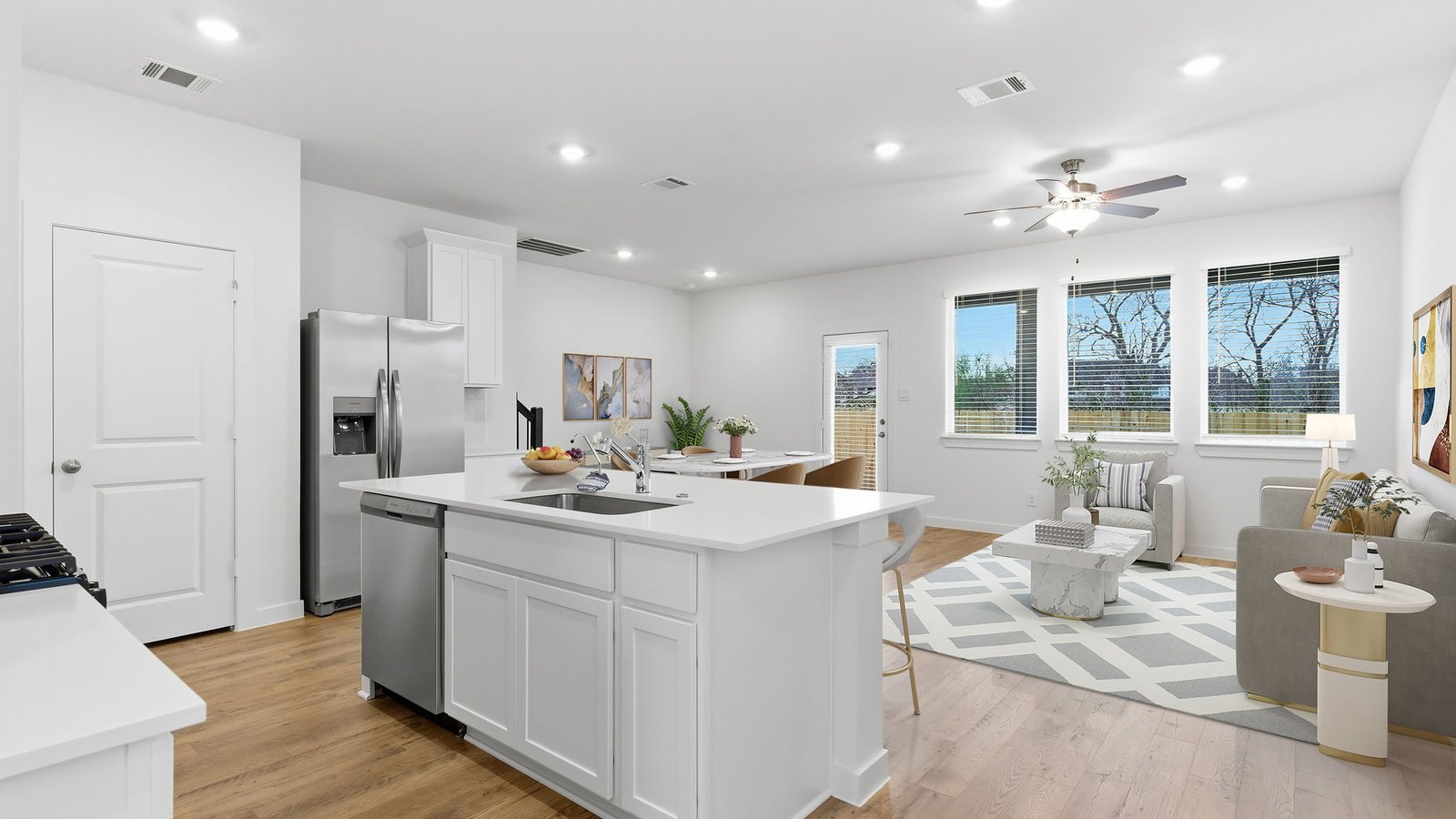 Kitchen with stainless steel appliances, shaker style cabinets, and elevated finishes